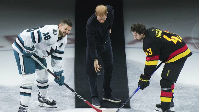 Prince Harry walks in late Queen&apos;s steps as he drops puck at hockey